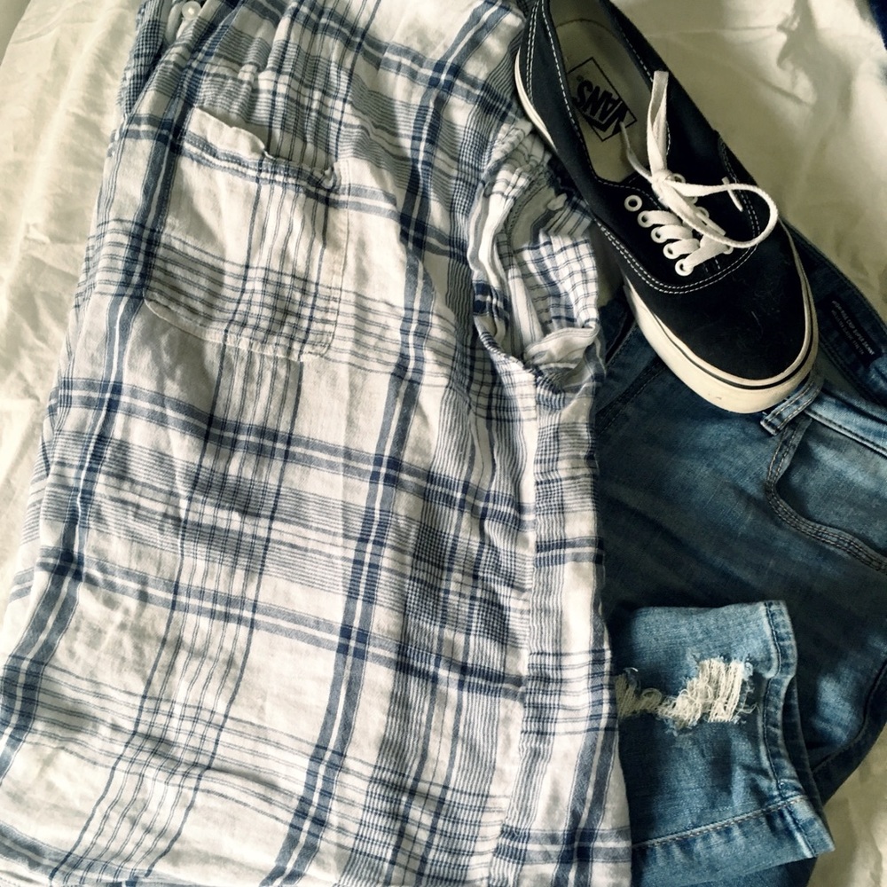 Plaid button up shirt.